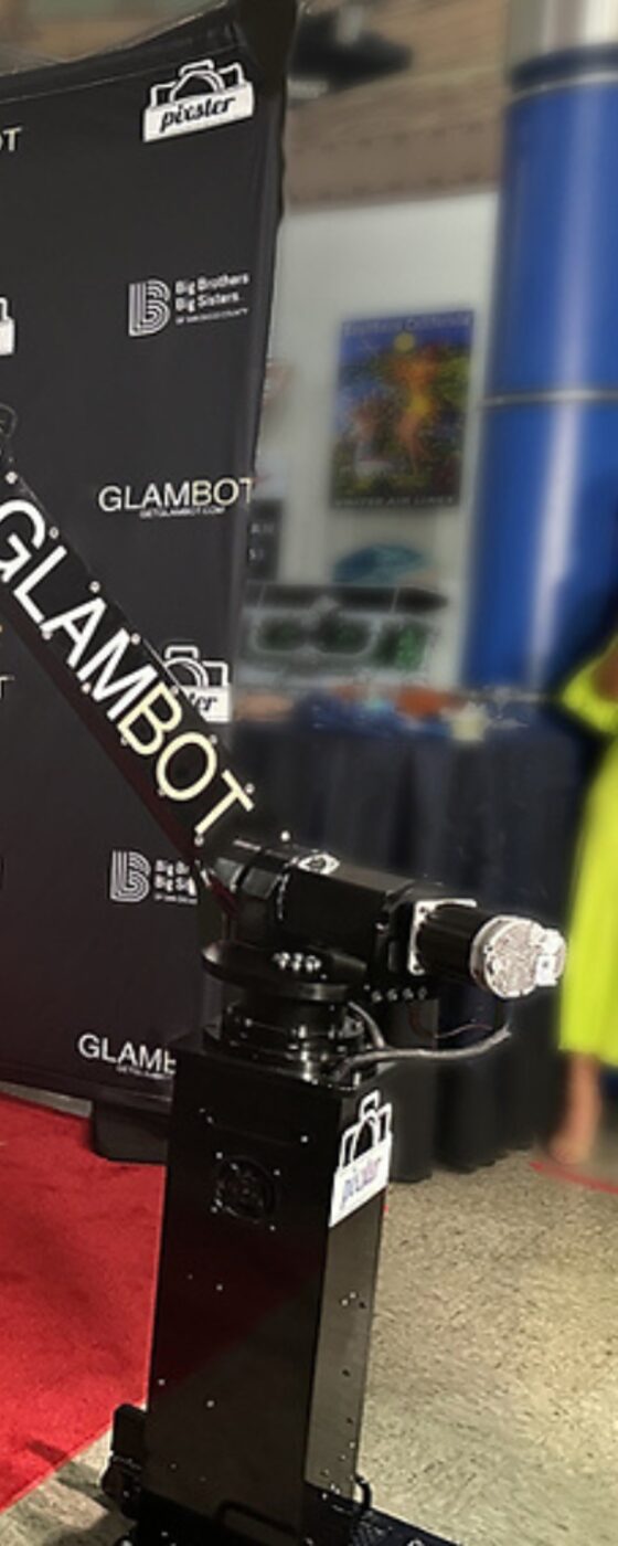 The GlamBot robotic camera arm beside a red carpet